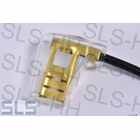 Interference suppression capacitor with flat plug
